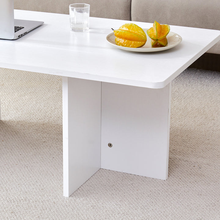 A modern and practical white coffee table. The coffee table is made of medium density fiberboard material, Suitable for living room, bedroom, and study.