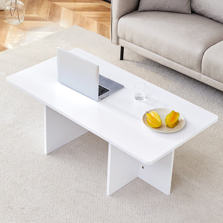 A modern and practical white coffee table. The coffee table is made of medium density fiberboard material, Suitable for living room, bedroom, and study.