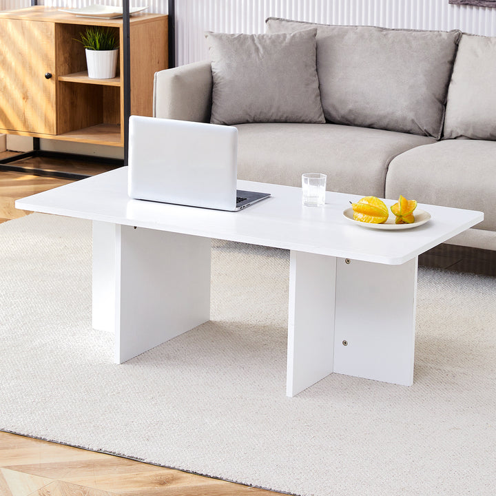 A modern and practical white coffee table. The coffee table is made of medium density fiberboard material, Suitable for living room, bedroom, and study.