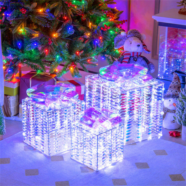 3 glowing Christmas gift boxes with bows