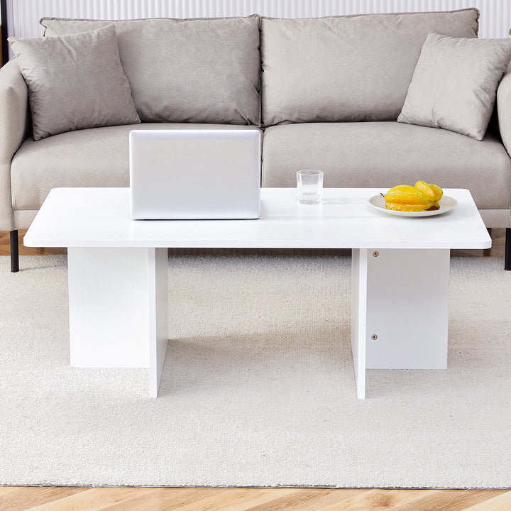 A modern and practical white coffee table. The coffee table is made of medium density fiberboard material, Suitable for living room, bedroom, and study.